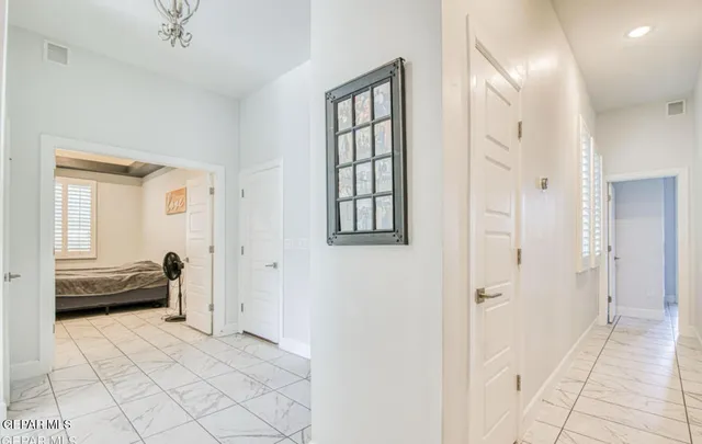 a view of a room that has a bed and a window