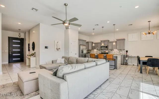 a kitchen with stainless steel appliances kitchen island granite countertop a sink and cabinets