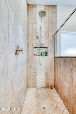 a bathroom with a bathtub and vanity