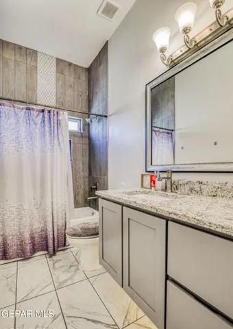 a kitchen with a stove and a microwave