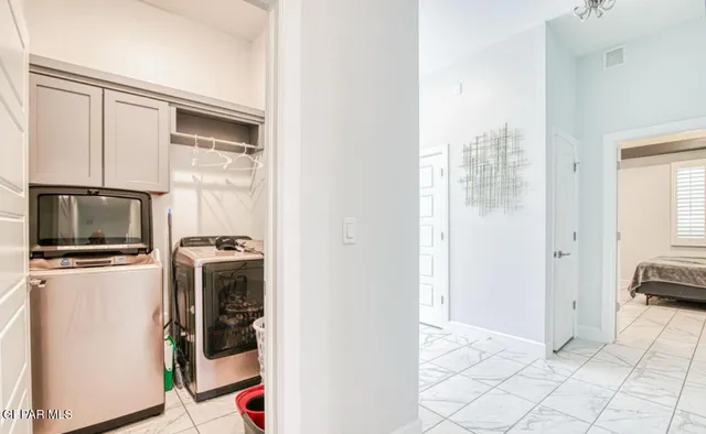 a view of a livingroom with the kitchen