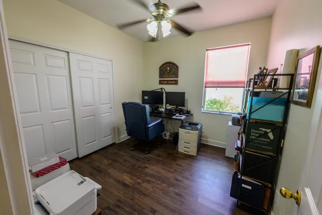 a workspace with furniture hardwood and a window