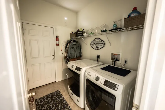 a utility room with dryer and washer