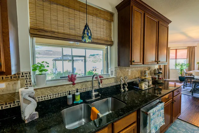 a kitchen with a sink and a stove