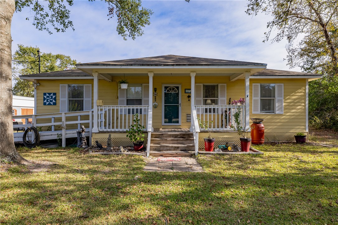 1566 Yaupon Road, Unit COUNTYROAD Bellville, TX 77418 - Photo 1 of 1 View of front facade featuring a front yard and co