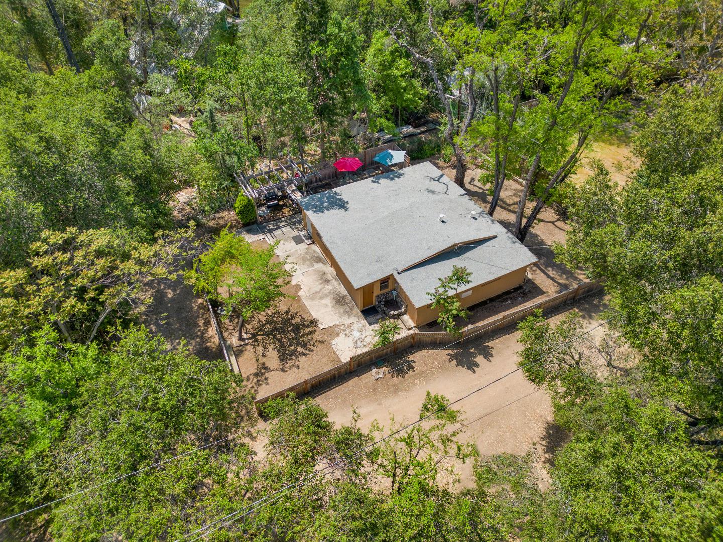 an aerial view of a house with yard swimming pool and outdoor seating