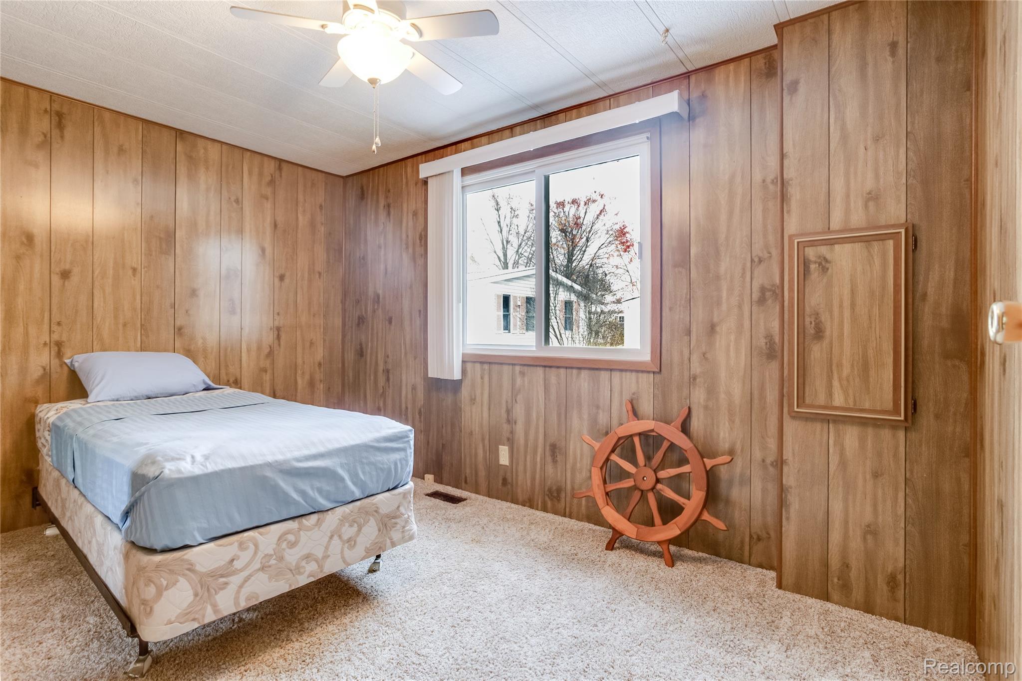 3333 Ravenswood Road Marysville, MI 48040 - Photo 13 of 25 Bedroom featuring carpet and a ceiling fan