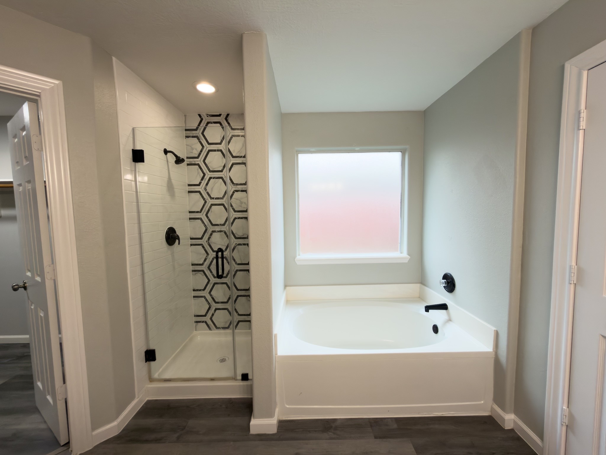 6626 Springfield Garden Lane Spring, TX 77379 - Photo 16 of 23 a bathroom with a bathtub and shower