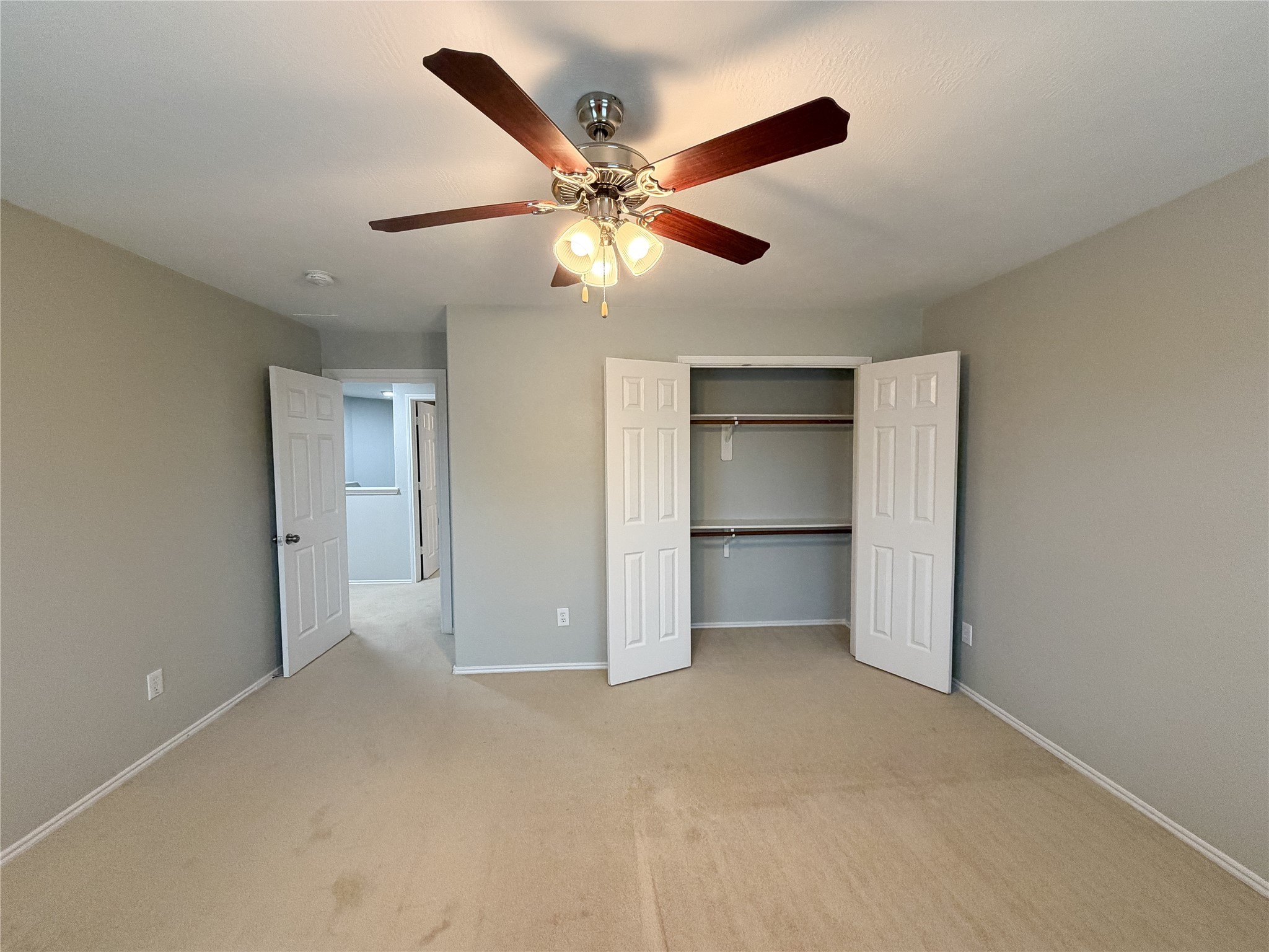 6626 Springfield Garden Lane Spring, TX 77379 - Photo 21 of 23 a view of an empty room with a ceiling fan