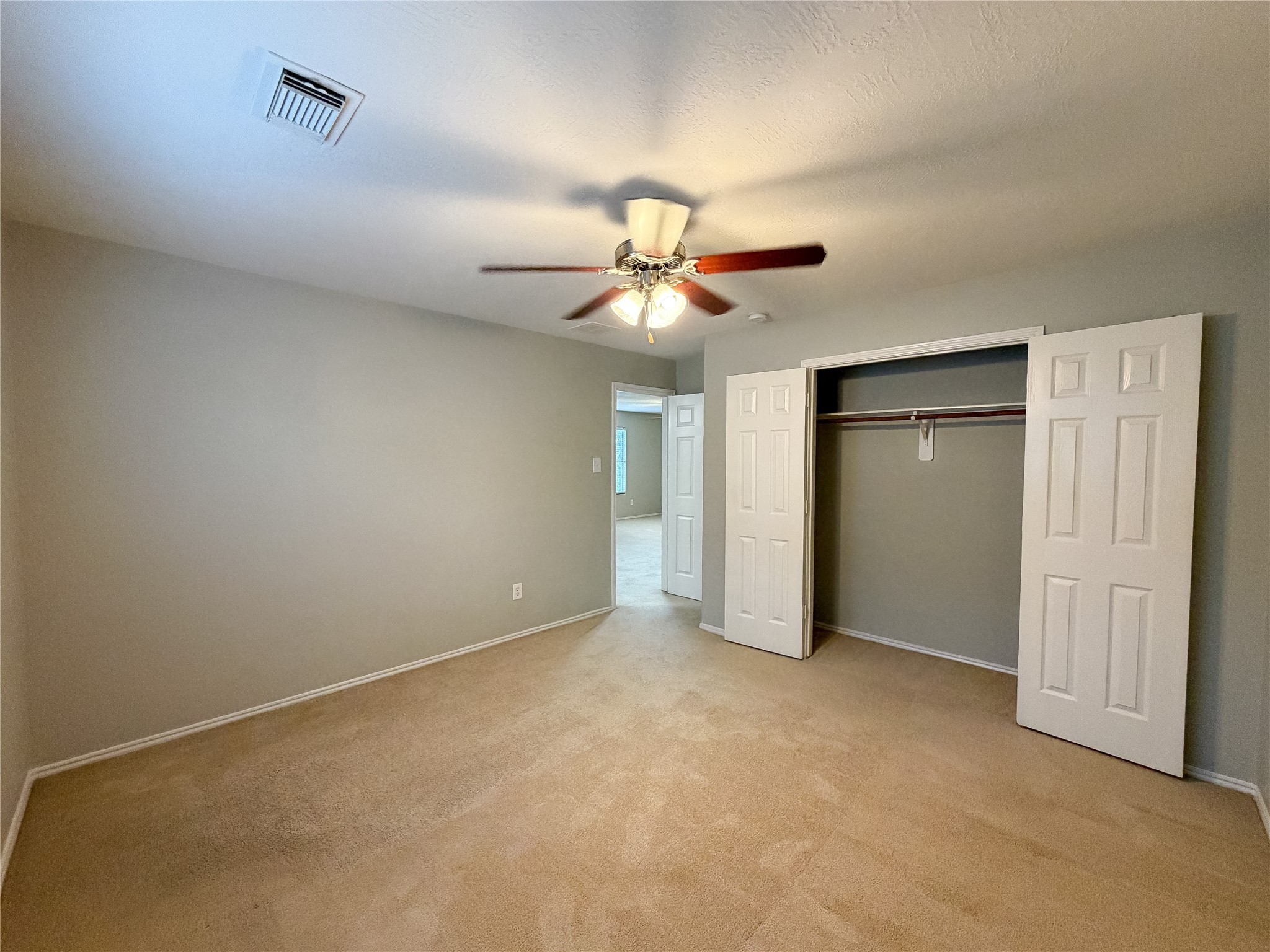 6626 Springfield Garden Lane Spring, TX 77379 - Photo 23 of 23 an empty room with a ceiling fan and a window