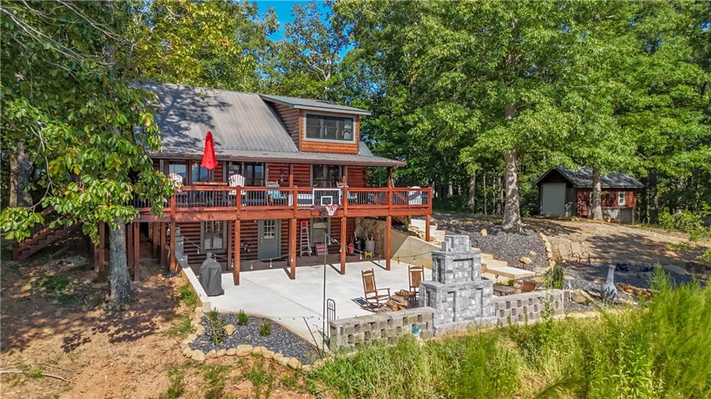 832 Scenic Mountain View Road Blue Ridge, GA 30513 - Photo 52 of 56 a view of house with yard outdoor seating and covered with trees