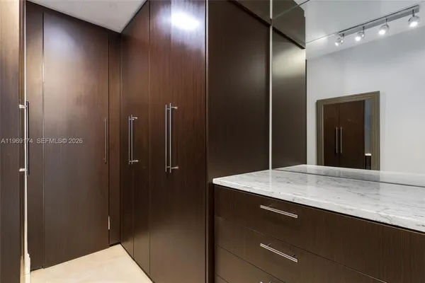 a bathroom with a shower sink and mirror