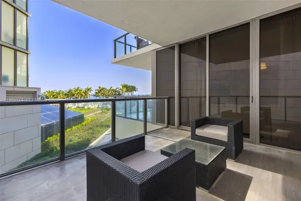 a view of balcony with furniture
