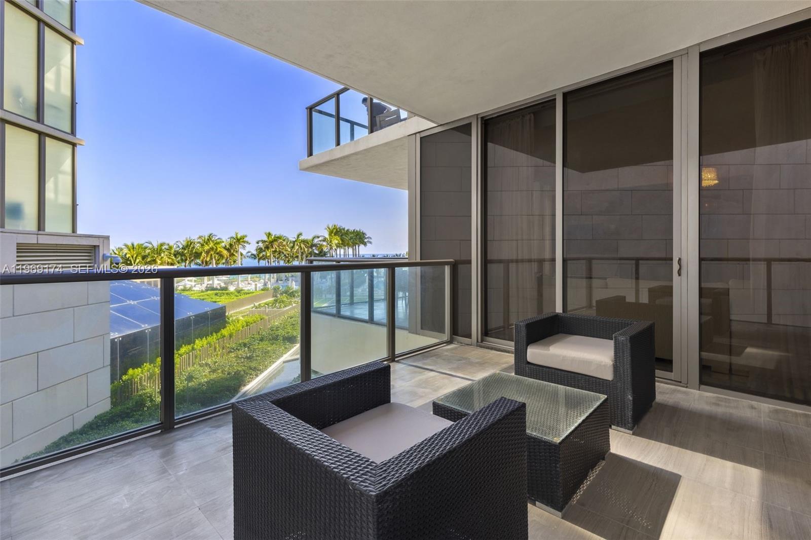 9701 Collins Avenue, Unit 404S Bal Harbour, FL 33154 - Photo 20 of 40 a view of balcony with furniture