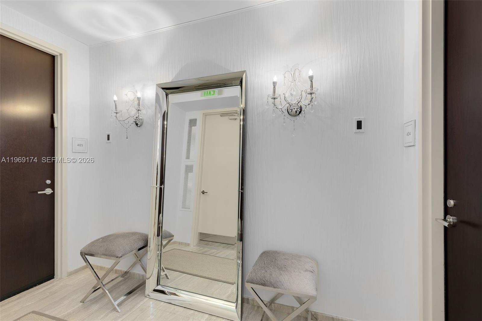 9701 Collins Avenue, Unit 404S Bal Harbour, FL 33154 - Photo 24 of 40 a bathroom with a granite countertop mirror and a shower