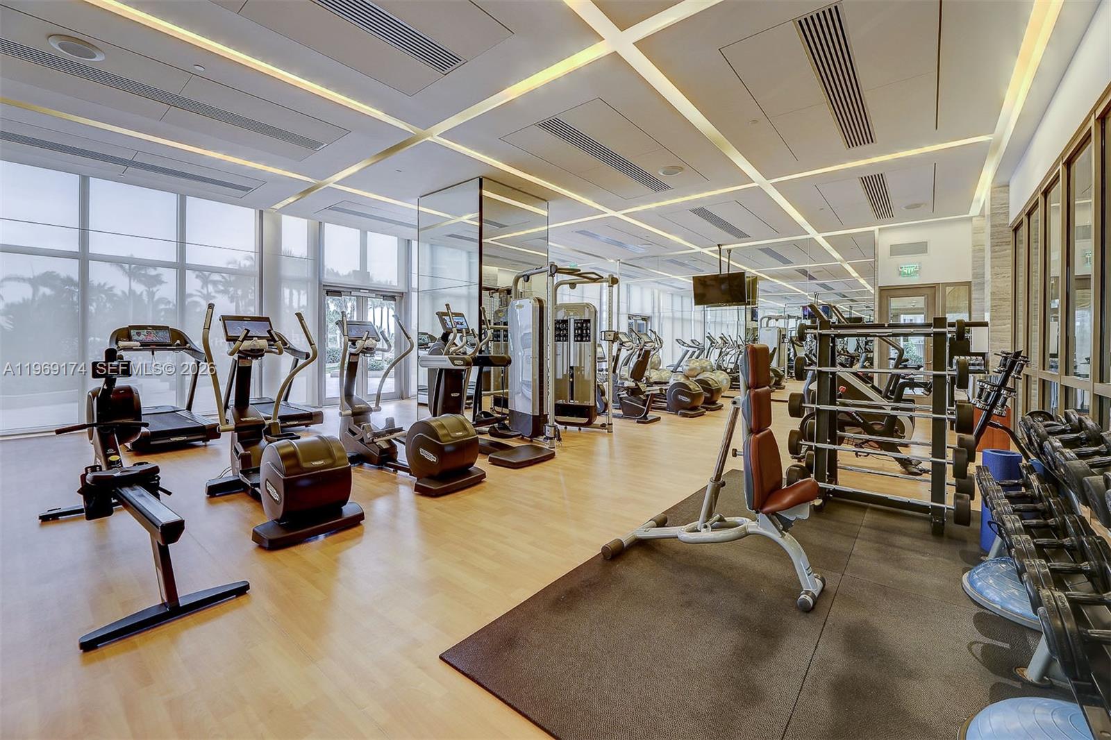 9701 Collins Avenue, Unit 404S Bal Harbour, FL 33154 - Photo 30 of 40 a view of a room with gym equipment