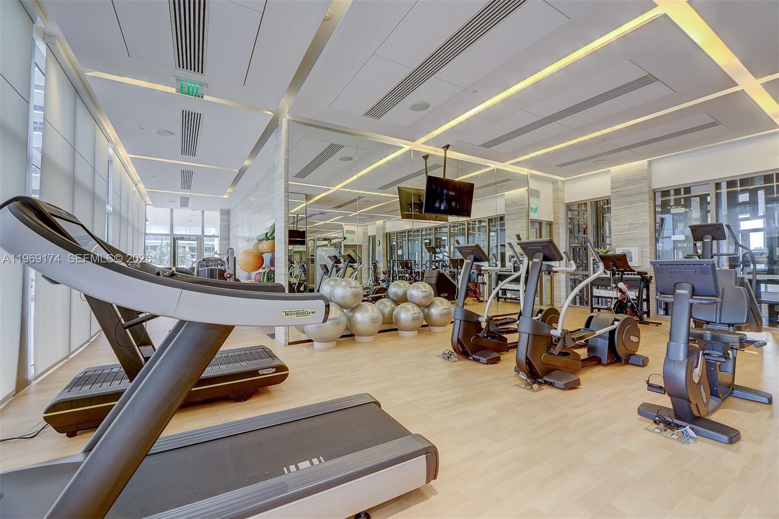 9701 Collins Avenue, Unit 404S Bal Harbour, FL 33154 - Photo 31 of 40 a view of a room with gym equipment