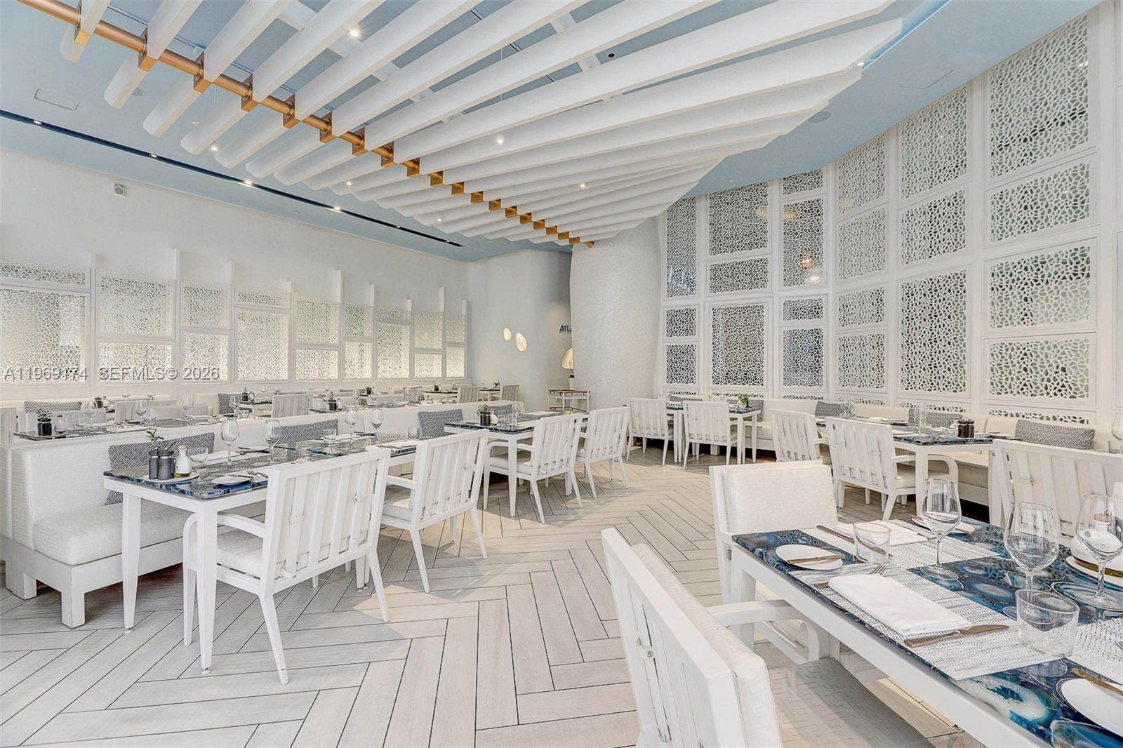9701 Collins Avenue, Unit 404S Bal Harbour, FL 33154 - Photo 36 of 40 a view of a dining room with furniture window and outside view