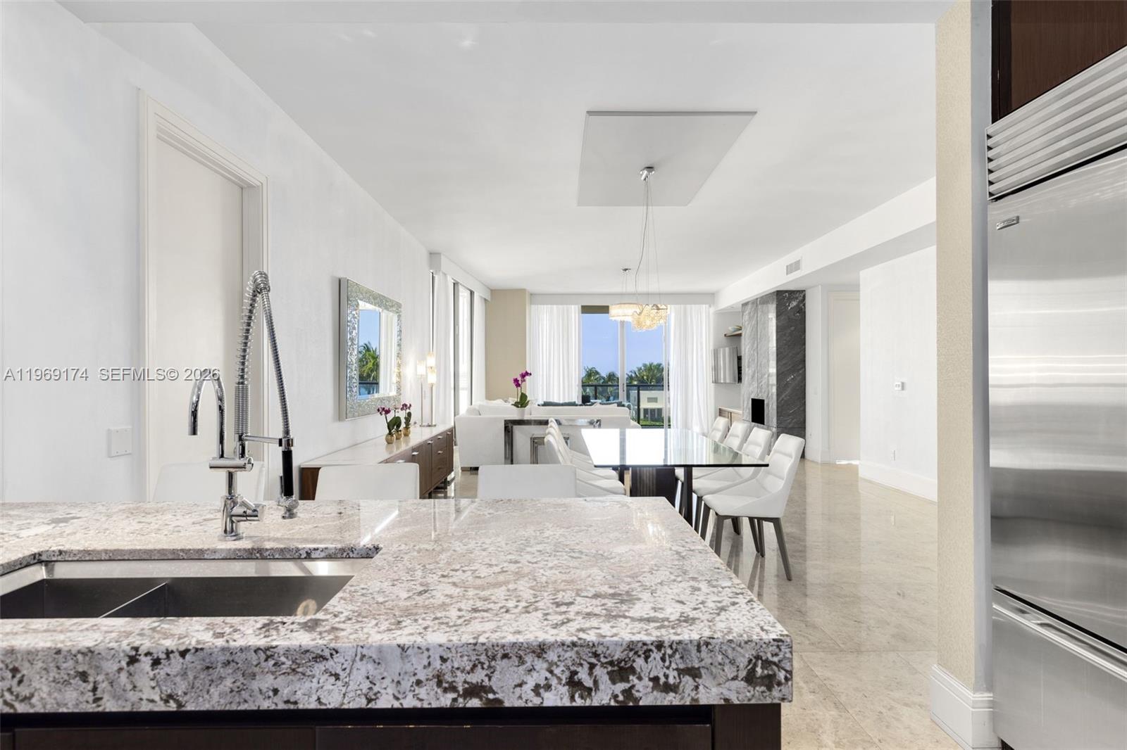 9701 Collins Avenue, Unit 404S Bal Harbour, FL 33154 - Photo 7 of 40 a very nice looking dining room with a table and chairs