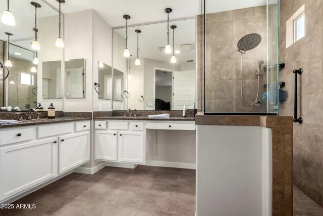 a bathroom with a double vanity sink mirror and double