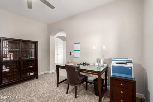 a dining room with a table and chairs