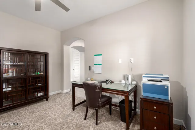 a dining room with a table and chairs