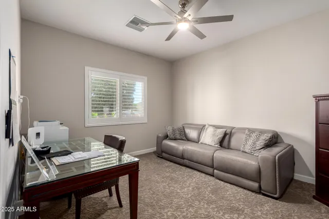 a living room with furniture and a window