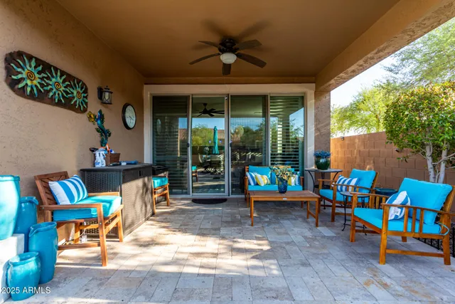 a outdoor space with chairs and a table