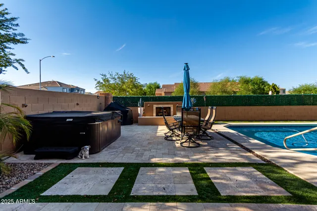 a view of a backyard with sitting area