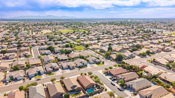 an aerial view of residential building with parking space