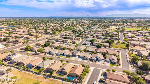 an aerial view of residential building with parking space