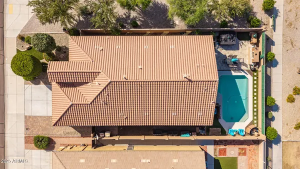a view of a small house and a yard