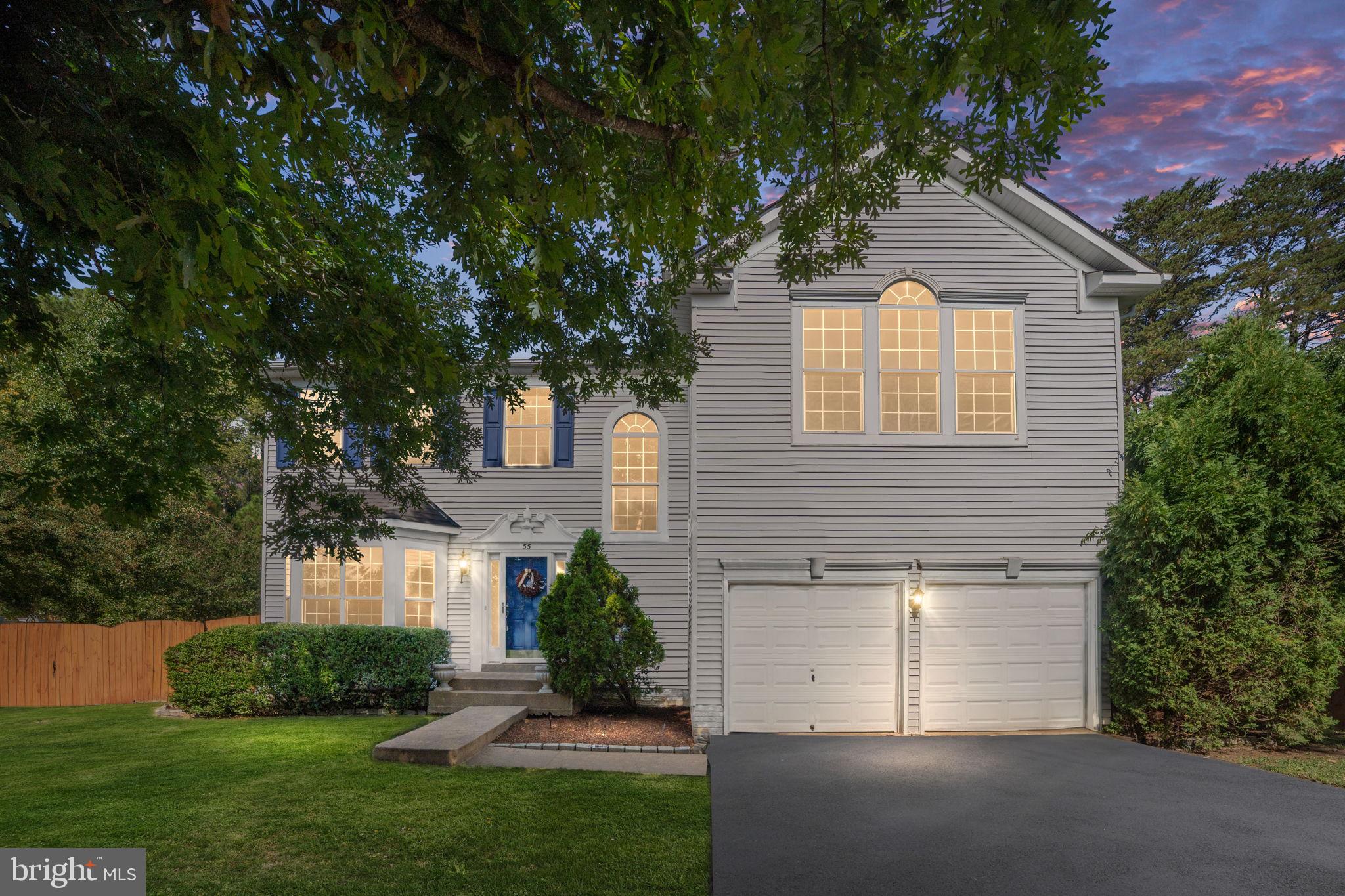 55 Hamstead Road Fredericksburg, VA 22405 - Photo 1 of 58 a front view of a house with a yard and garage