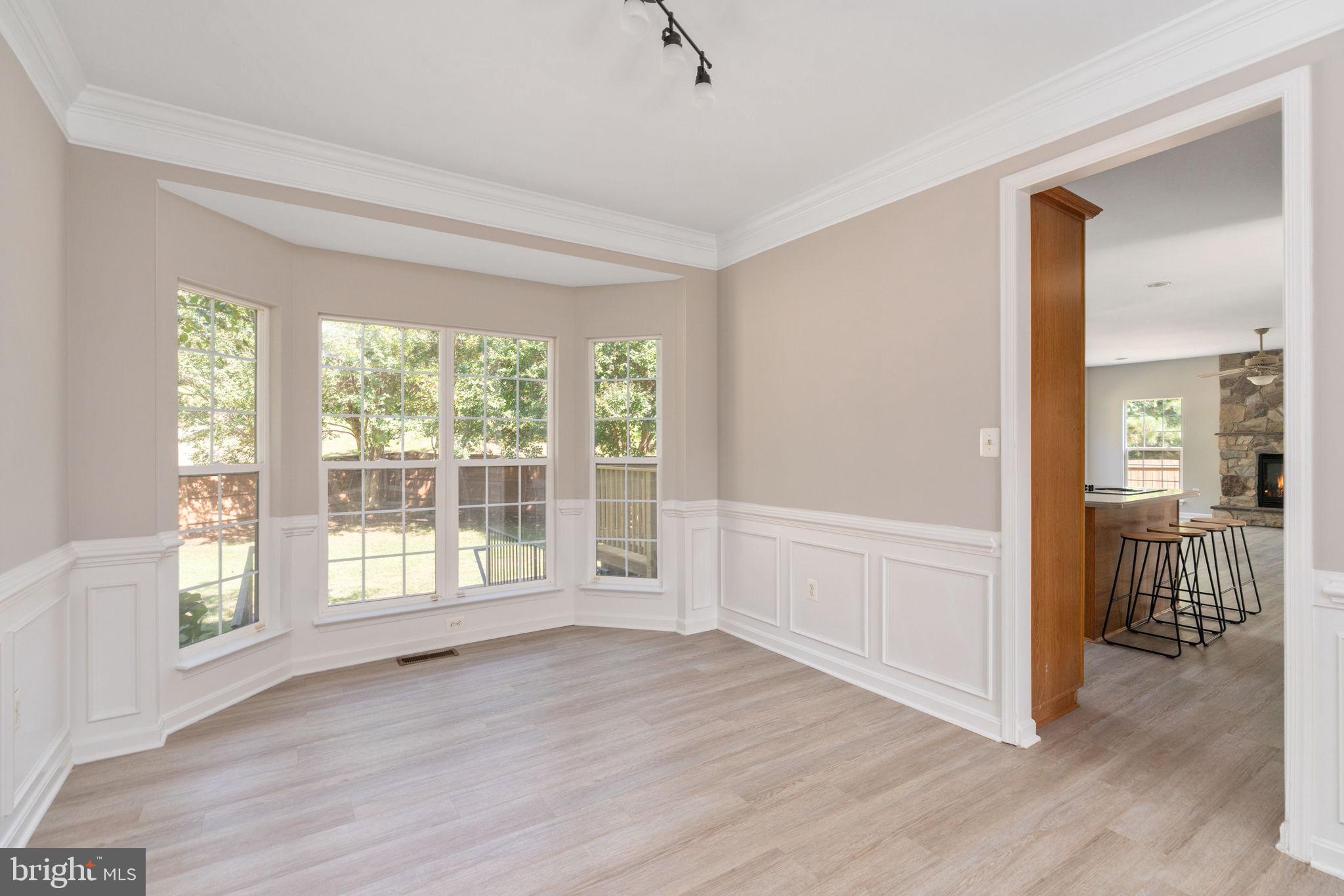 55 Hamstead Road Fredericksburg, VA 22405 - Photo 11 of 58 a view of an empty room with wooden floor and a window