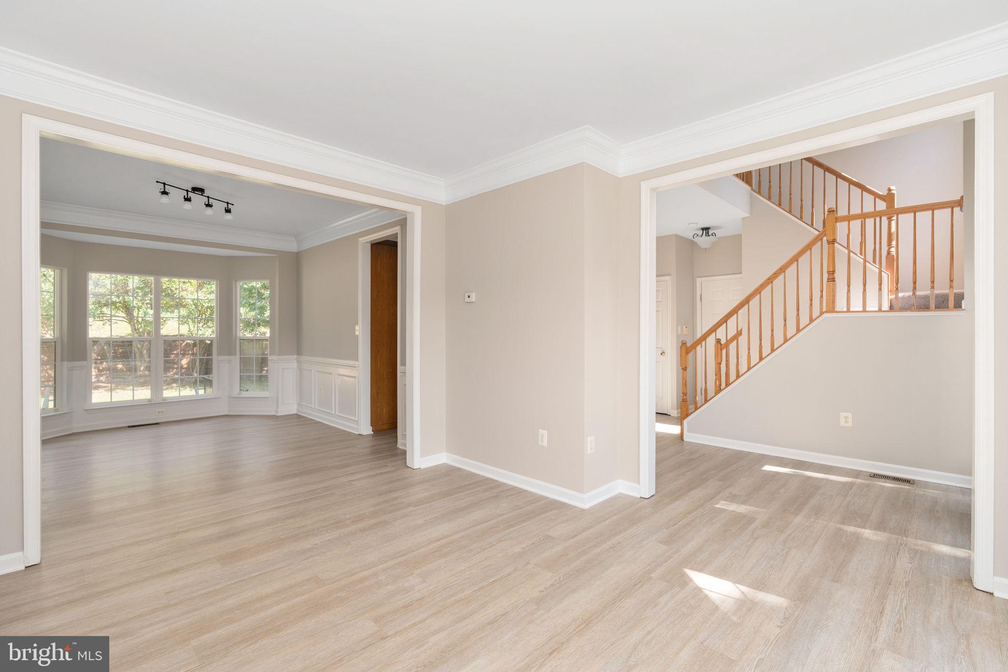 55 Hamstead Road Fredericksburg, VA 22405 - Photo 13 of 58 a view of an empty room with wooden floor and a window