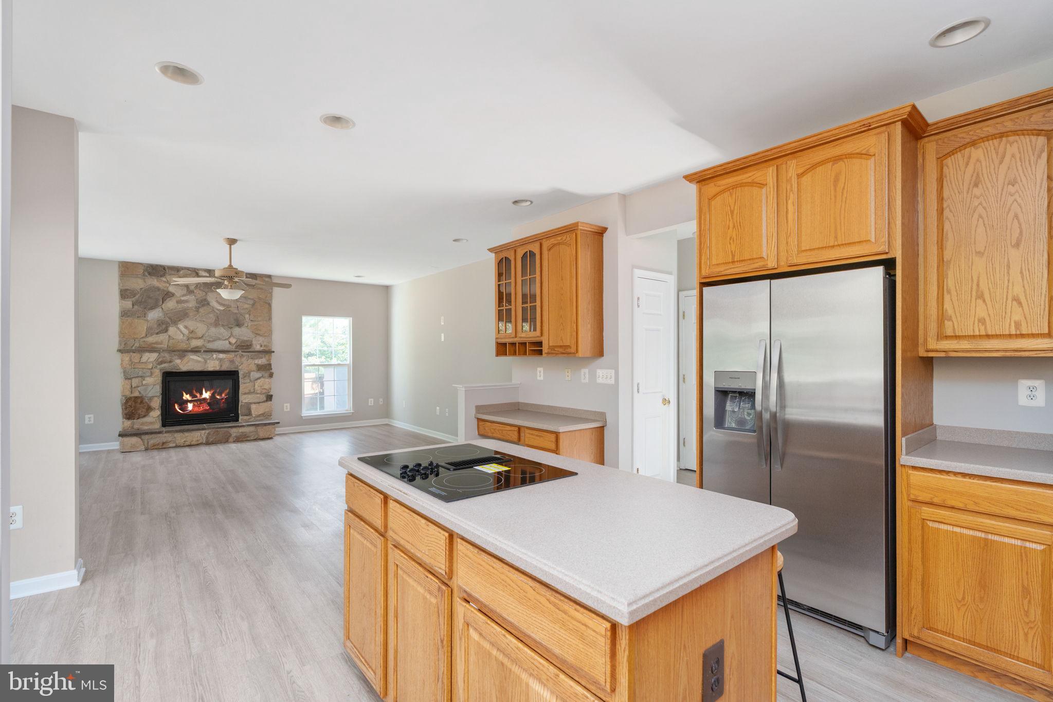 55 Hamstead Road Fredericksburg, VA 22405 - Photo 22 of 58 a kitchen with a refrigerator a stove top oven and a refrigerator