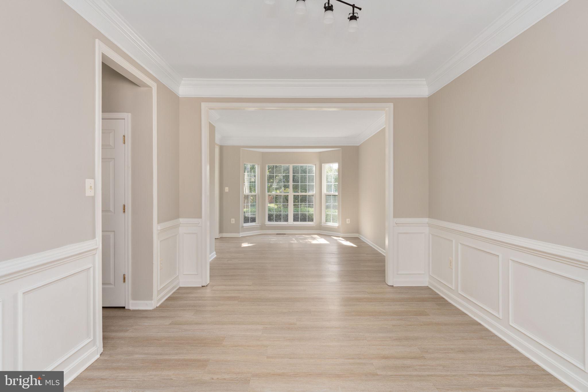 55 Hamstead Road Fredericksburg, VA 22405 - Photo 9 of 58 a view of an empty room with wooden floor and a window