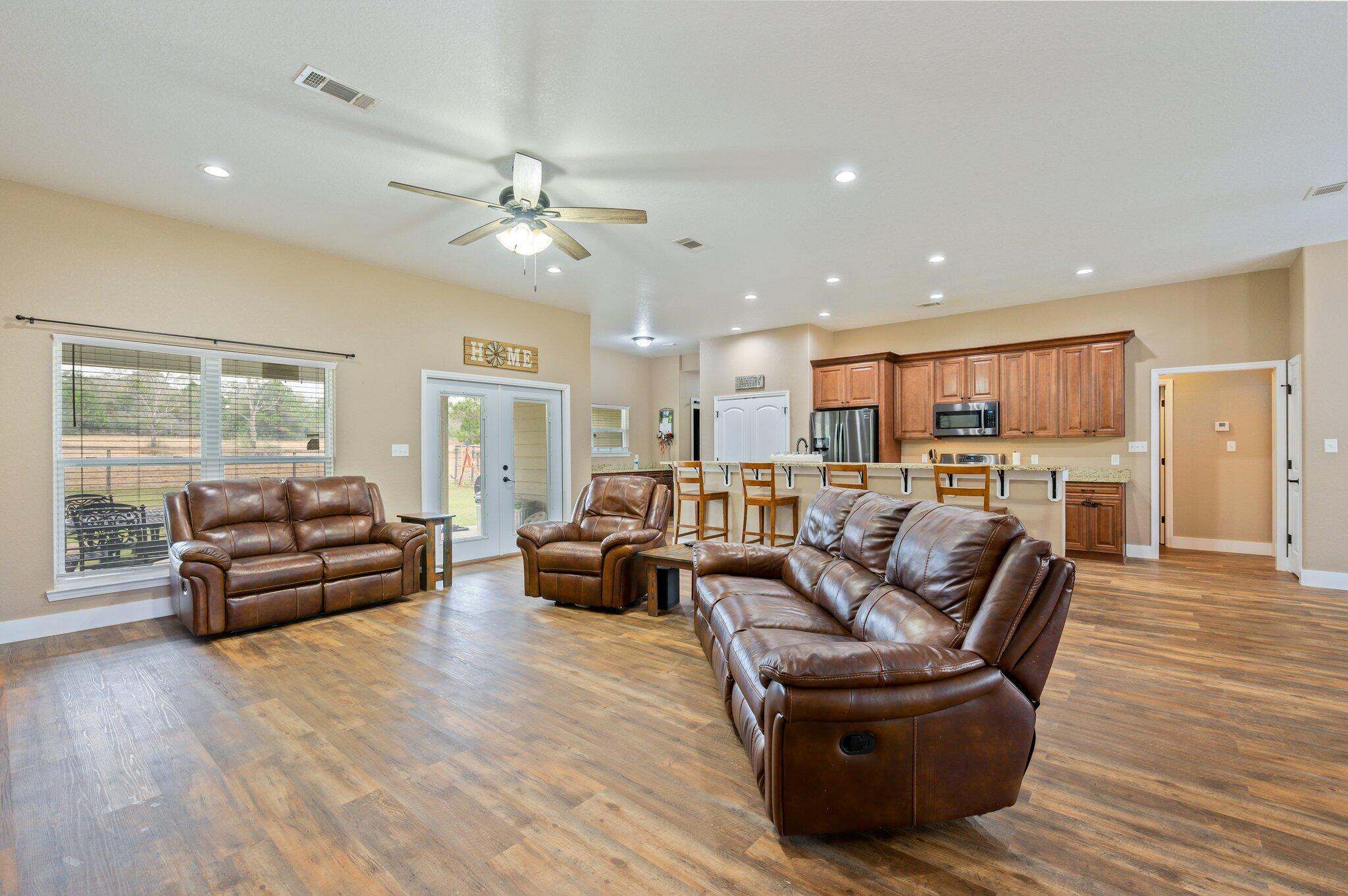 6499 Holloway Road Baker, FL 32531 - Photo 8 of 45 a living room with furniture dining area and a wooden floor