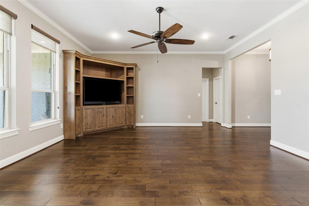 1617 Hawthorne Street Cleburne, TX 76033 - Photo 15 of 40 a view of a livingroom with a flat screen tv