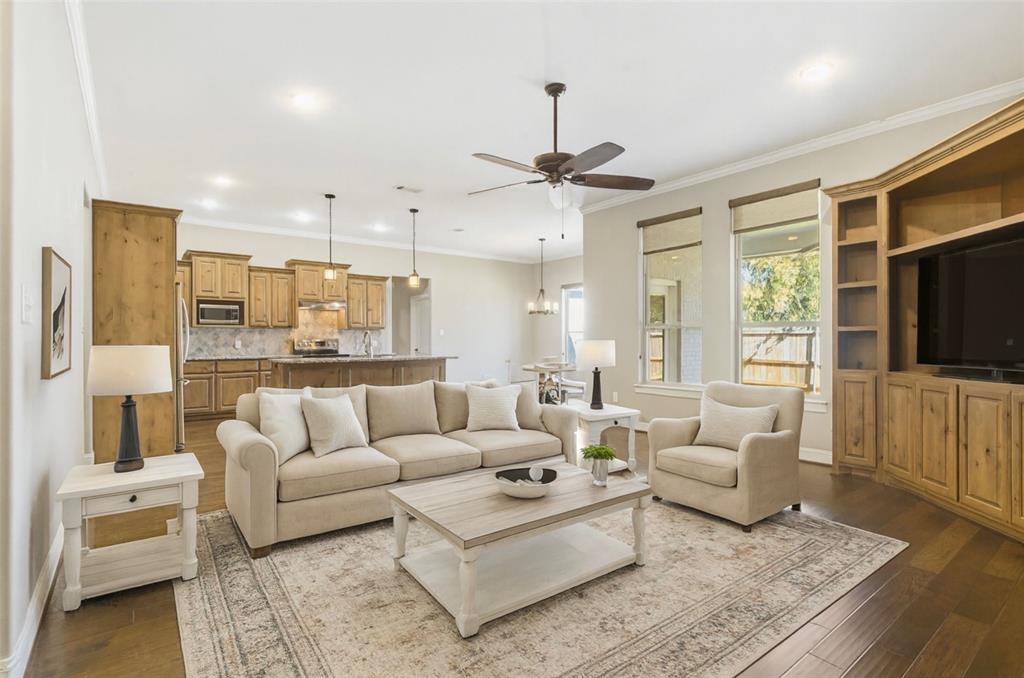 1617 Hawthorne Street Cleburne, TX 76033 - Photo 17 of 40 a living room with furniture and a flat screen tv