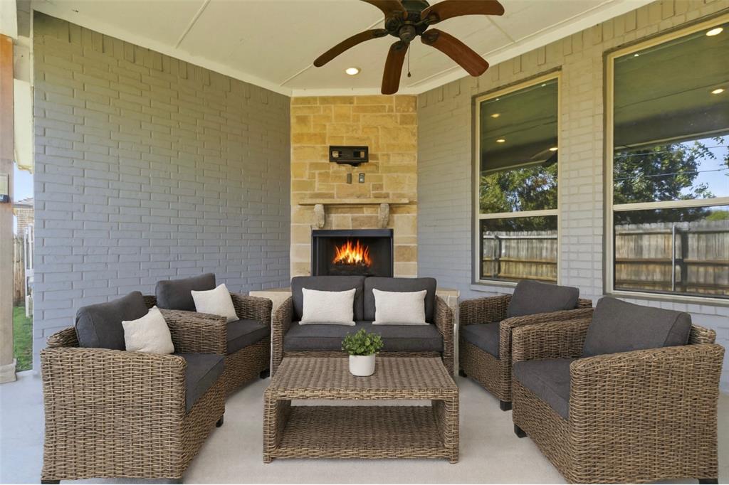 1617 Hawthorne Street Cleburne, TX 76033 - Photo 35 of 40 a living room with furniture and a fireplace