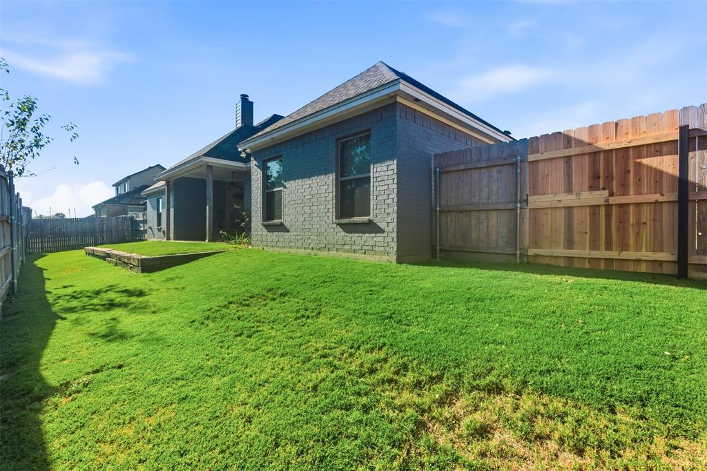 1617 Hawthorne Street Cleburne, TX 76033 - Photo 36 of 40 a front view of a house with yard and green space