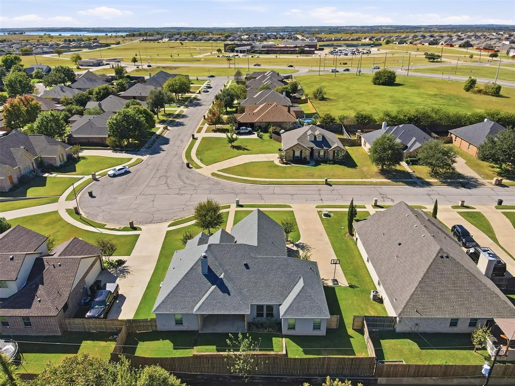 1617 Hawthorne Street Cleburne, TX 76033 - Photo 37 of 40 a aerial view of a swimming pool with outdoor seating and yard