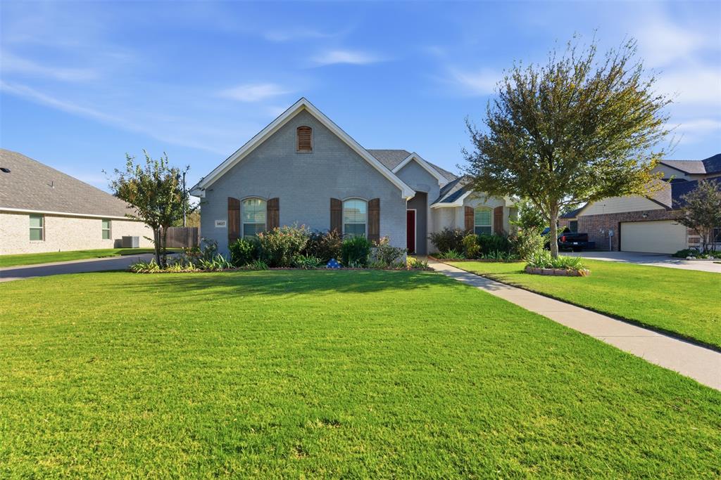1617 Hawthorne Street Cleburne, TX 76033 - Photo 4 of 40 a front view of house with yard and green space