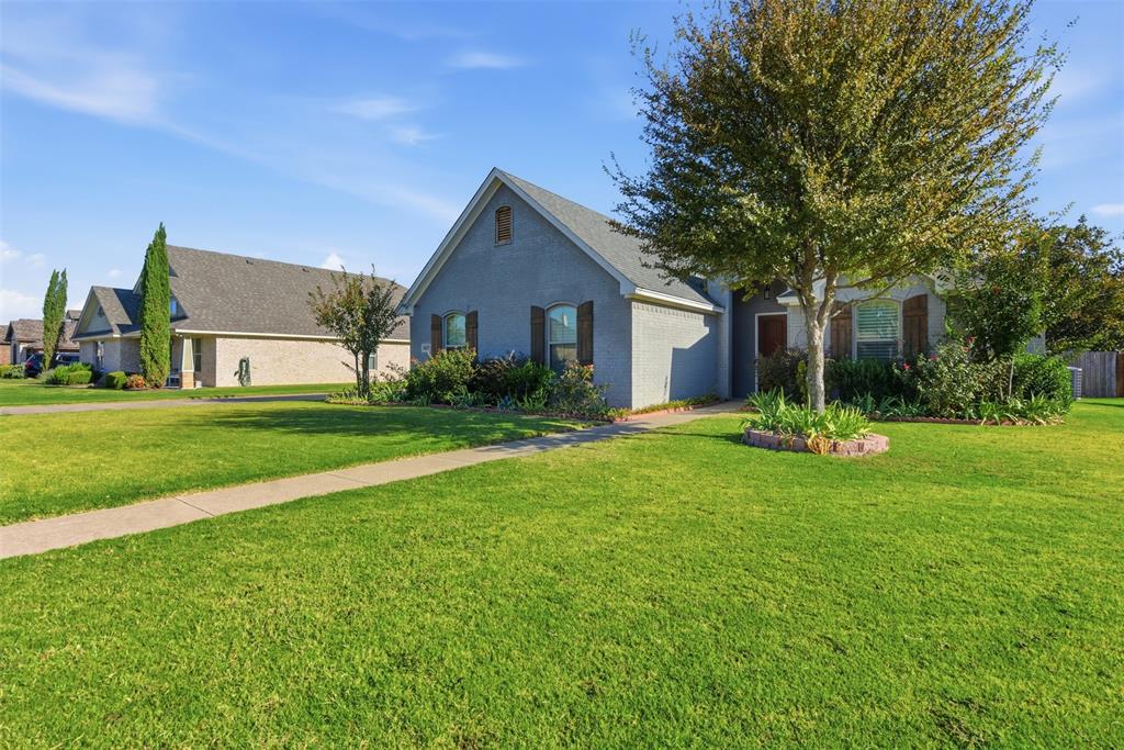 1617 Hawthorne Street Cleburne, TX 76033 - Photo 5 of 40 a front view of house with yard and green space