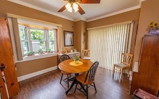 228 Clover Street Pittsburgh, PA 15210 - Photo 12 of 46 a dining room with furniture and wooden floor