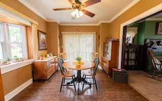 228 Clover Street Pittsburgh, PA 15210 - Photo 13 of 46 a view of a a dining room with furniture window and outside view