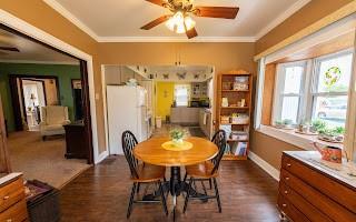 228 Clover Street Pittsburgh, PA 15210 - Photo 14 of 46 a view of a dining room with furniture window and wooden floor