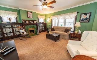 228 Clover Street Pittsburgh, PA 15210 - Photo 21 of 46 a living room with furniture and a floor to ceiling window