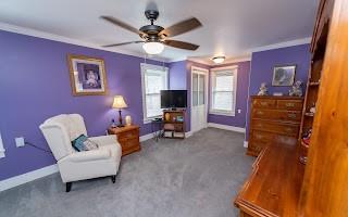 228 Clover Street Pittsburgh, PA 15210 - Photo 25 of 46 a living room with furniture and a flat screen tv